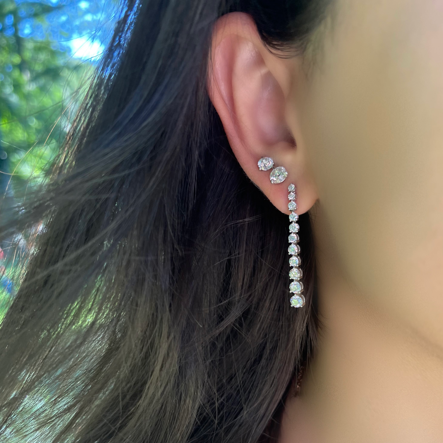 Graduated Round Diamond Drop Earrings on Ear