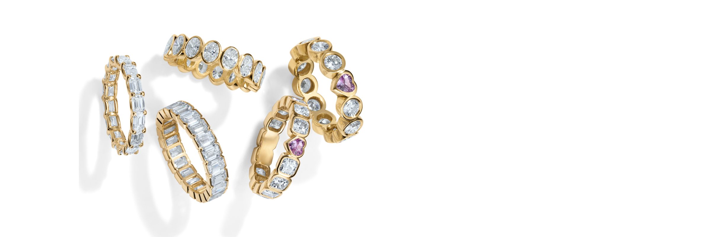A cluster of gold eternity bands set with diamonds