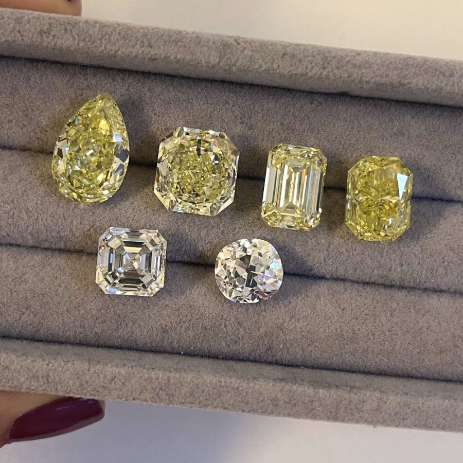 A tray of loose fancy-yellow and white diamonds in assorted cuts
